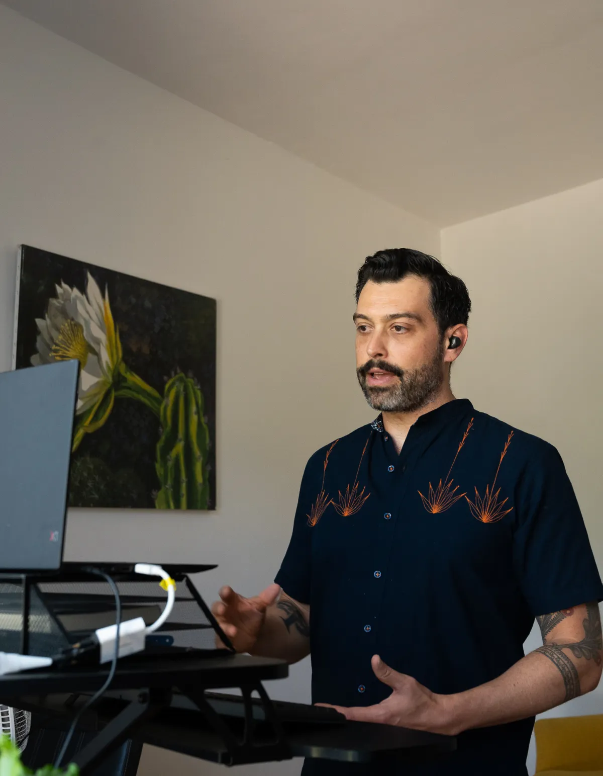 Brandon Brown coaching a client from his New Orleans standing desk